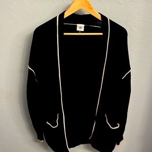 Black with cream piped stitching CAbi cardigan. Size Medium